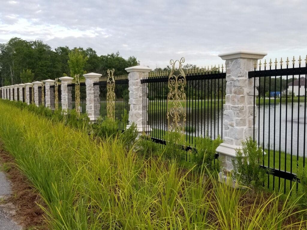 Florida Outdoor Products - Artistry in Steel: Custom Fence with Hand-Crafted Scrollwork Inla