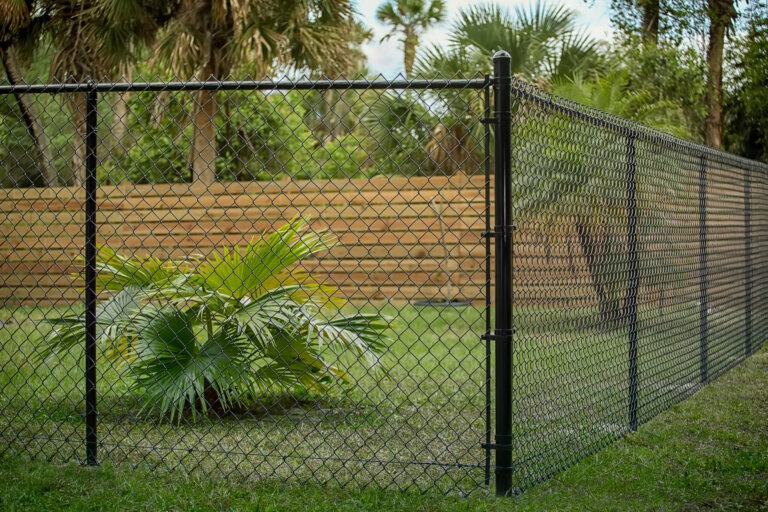 Chain link fence is also attractive, shown here with a wood fence in the background