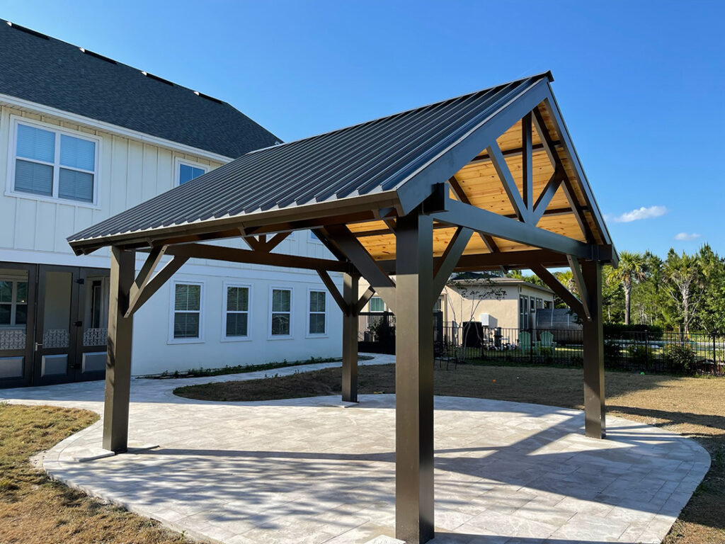 Florida Outdoor Products - Traditional Style Pergola with Pine Tongue and Groove Ceiling on New Pavers. A standard in our outdoor living showcase.