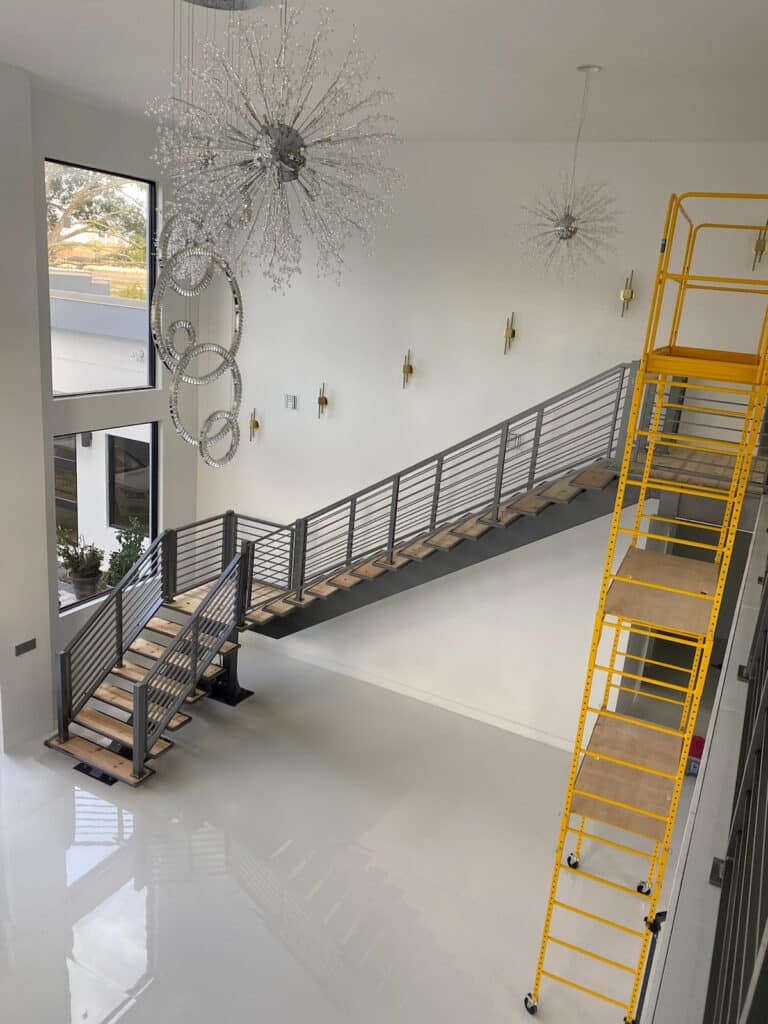 Florida Outdoor Products - Second-Floor View of Custom Floating Staircase with Oak Treads and Gun Metal Grey Modern Horizontal Rail